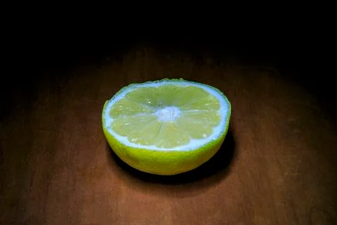 Isolated slice of lemon in the shadow Stock Photos