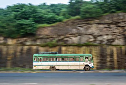Isolated , slow shutter speed panning image of a speeding bus on highway. Foto stock