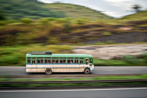Isolated , slow shutter speed panning image of a speeding bus on highway. Stock Photos