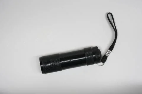 Isolated small flashlight on a white background Stock Photos