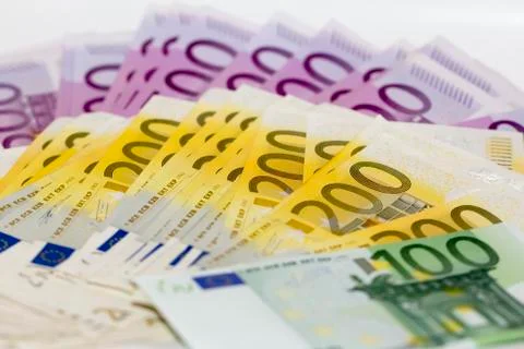 Isolated stack of money with 100 200 and 500 euro banknotes Stock Photos