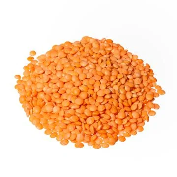 Isolated stack of uncooked lentils on white background from above. Top view. Stock Photos