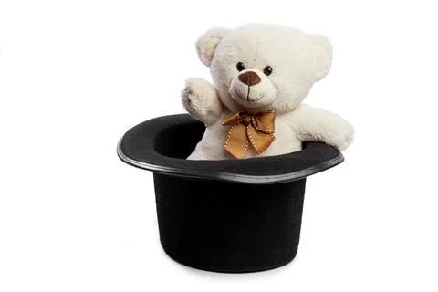 Isolated teddy bear with giant black hat Stock Photos