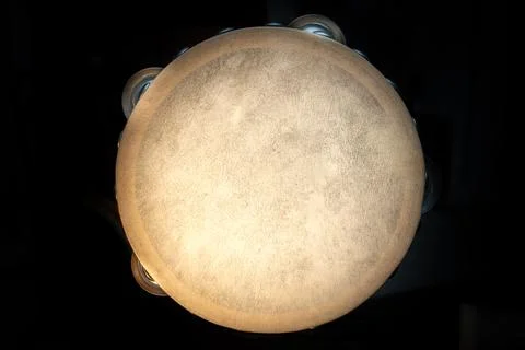 Isolated Top Down View of Top of Tambourine on Black Background Foto stock