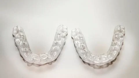 Isolated transparent teeth prosthesis over white for deisgn 스톡 사진
