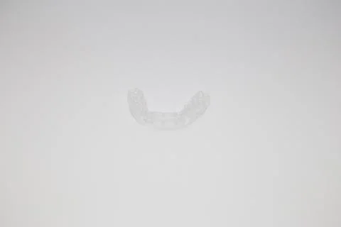 Isolated transparent teeth prosthesis over white for design Fotos Stock