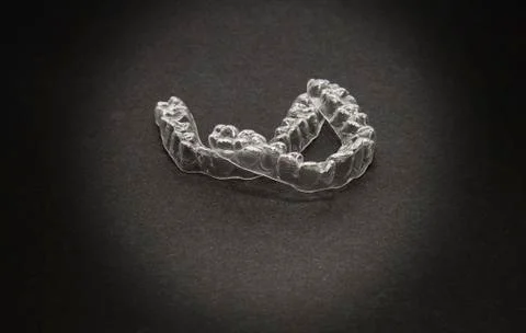 Isolated transparent teeth prosthesis over black for design Stock-Fotos