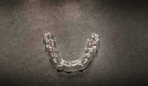 Isolated transparent teeth prosthesis over black for design Stock-Fotos