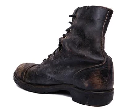 Isolated used army boot - diagonal heel Stock Photos