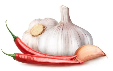 Isolated vegetables. Two garlic with segment and two red hot chili peppers Stock Photos