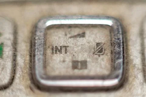 Isolated view of the insert key on a dusty old keyboard for data entry concept Фото