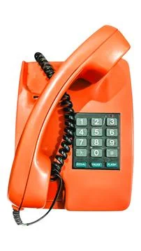 Isolated view. A red old-fashioned telephone. Stock Photos