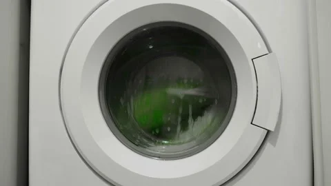 Isolated washing machine working on cleaning family clothes,electicity wastage Stock Footage 160764160