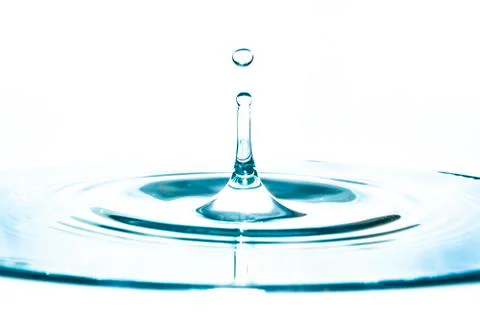 Isolated water drop splash against white background Stock Photos