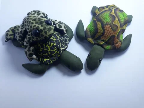 Isolated on white artificial frogs and turtle toys for decorations or gifts Photos