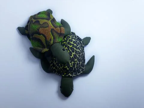 Isolated on white artificial frogs and turtle toys for decorations or gifts Photos