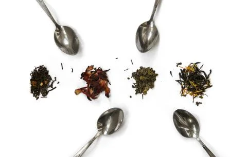 Isolated white background spoon tea. Green fruit black tea grade Stock Photos