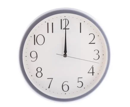 Isolated white clock at 12 Stock Photos