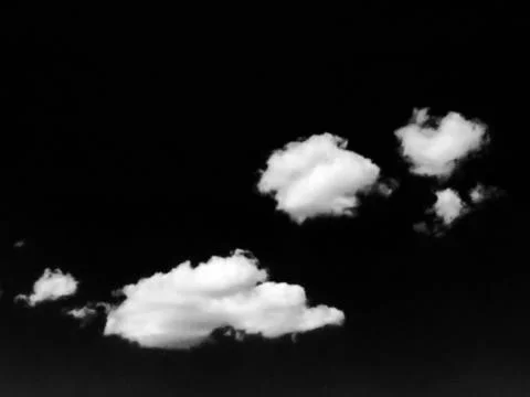Isolated white clouds on black sky. Set of isolated clouds over black backgro Stock Photos