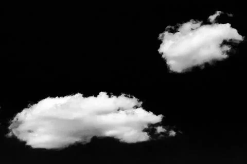 Isolated white clouds on black sky. Set of isolated clouds over black backgro 스톡 사진