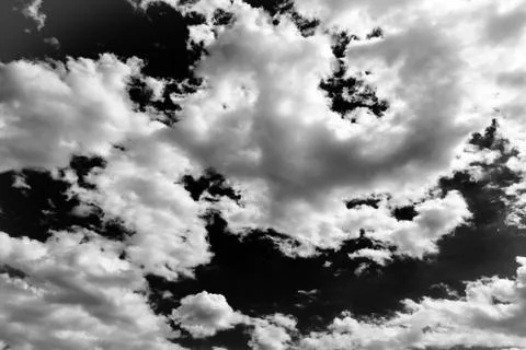Isolated white clouds on black sky. Set of isolated clouds over black backgro Stock-Fotos