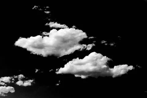 Isolated white clouds on black sky. Set of isolated clouds over black backgro 写真素材