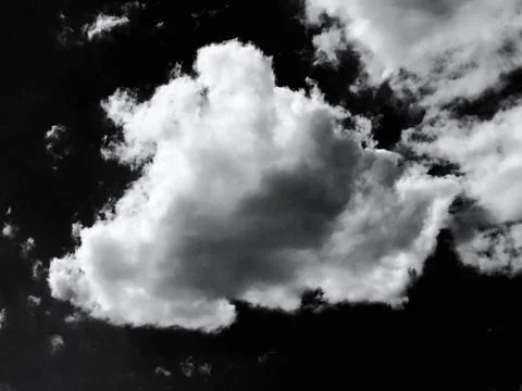 Isolated white clouds on black sky Stock Photos