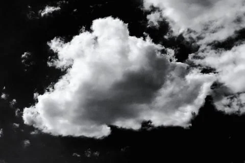 Isolated white clouds on black sky Stock-Fotos