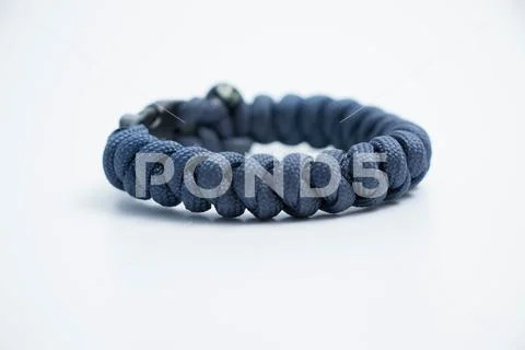 Isolated on white Single survival wristlet bracelet paracord knot Stock Photos