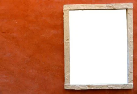 Isolated window frame in side of orange clay wall Stock Photos