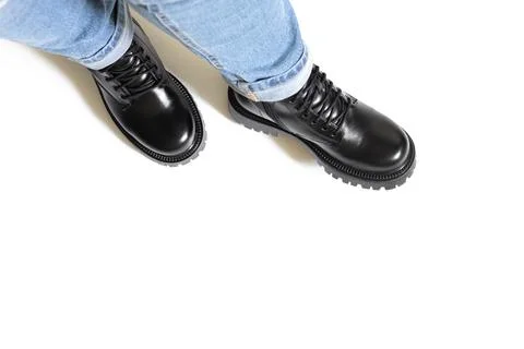 Isolated winter black boots both for man and women with round toe, block heel Stock Photos
