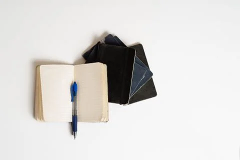 Isolated worn notebook with pen Stock Photos