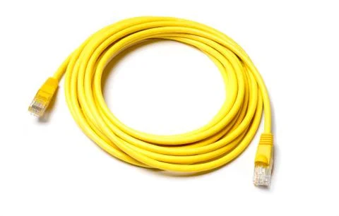 Isolated yellow patch cord internet cable on white background Stock Photos