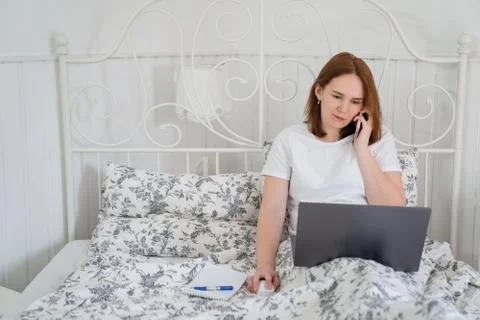 Isolation female freelancer work in bed  computer Stock Photos
