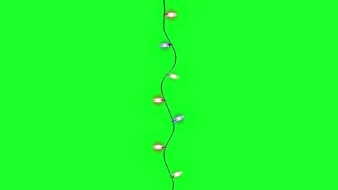 Isoleted christmas lights string on green background. Beautiful christmas lights Stock Footage 225843273