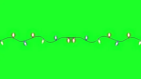 Isoleted christmas lights string on green background. Beautiful christmas lights Stock Footage 225843278