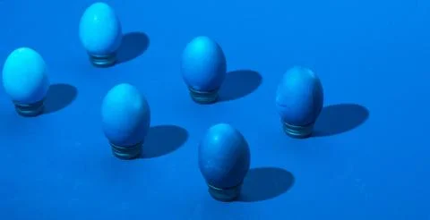 Isometric easter eggs layout. classic blue monochromatic composition. hard sh Stock Photos