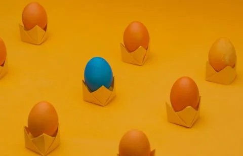 Isometric layout of Orange easter eggs on origami stands. Easter concept Stock Photos