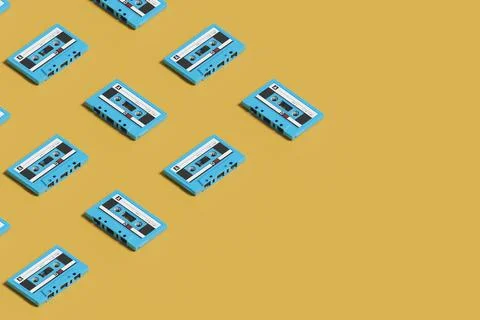 Isometric pattern of blue cassettes on yellow background. 3d illustration. Stock Photos