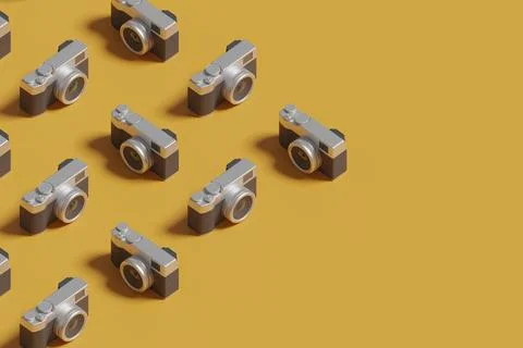 Isometric pattern of photo cameras on yellow background. 3d illustration. Stock Photos