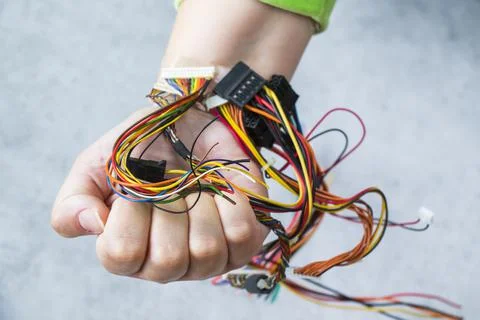 Isometric processor microchips connected to a human hand with wires concept of Stock-Fotos