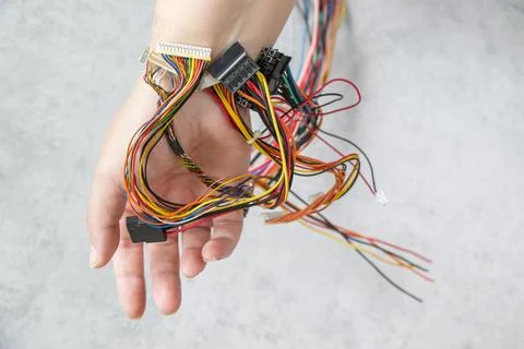 Isometric processor microchips connected to a human hand with wires concept of Stock Photos