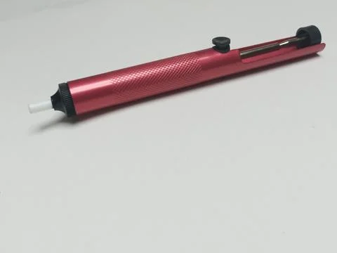 Isometric View of Pink Desoldering Pump Solder Sucker Tool Stock-Fotos