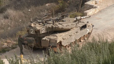 Israel, Circa 2011 - IDF tank driving next to the lebanon border Stock Footage 83633345