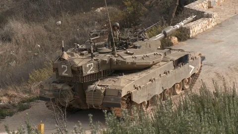 Israel, Circa 2011 - IDF tank driving next to the lebanon border Stock Footage 83633406