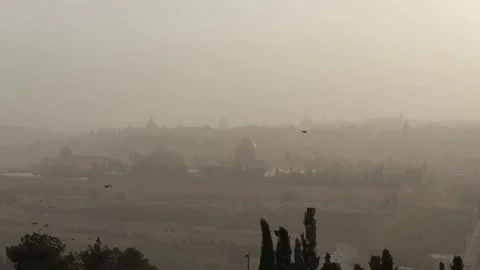 Israel: Dust storm strikes Jerusalem, reduces visibility Stock Footage 332939657