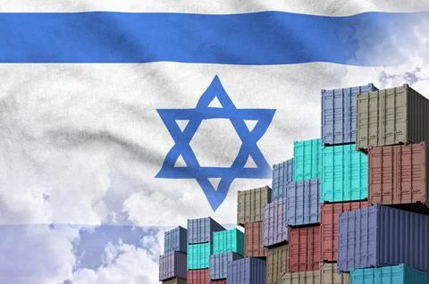 Israel flag and big stack of shipping cargo containers in docks with sky Foto stock
