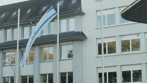 Israel flag in front of a building Stock Footage 253098998
