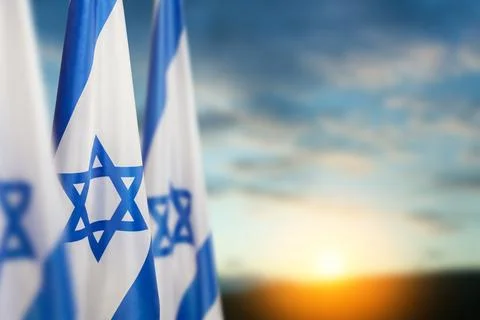 Israel flags with a star of David over cloudy sky background on sunset. Patri Stock Illustration