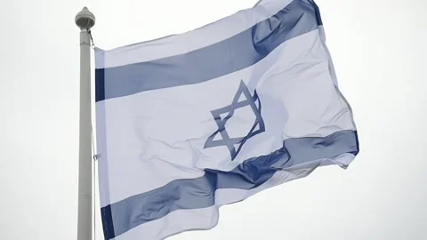 Israel state flag blown by the wind on a pole with clear sky on background Video stock 241510585